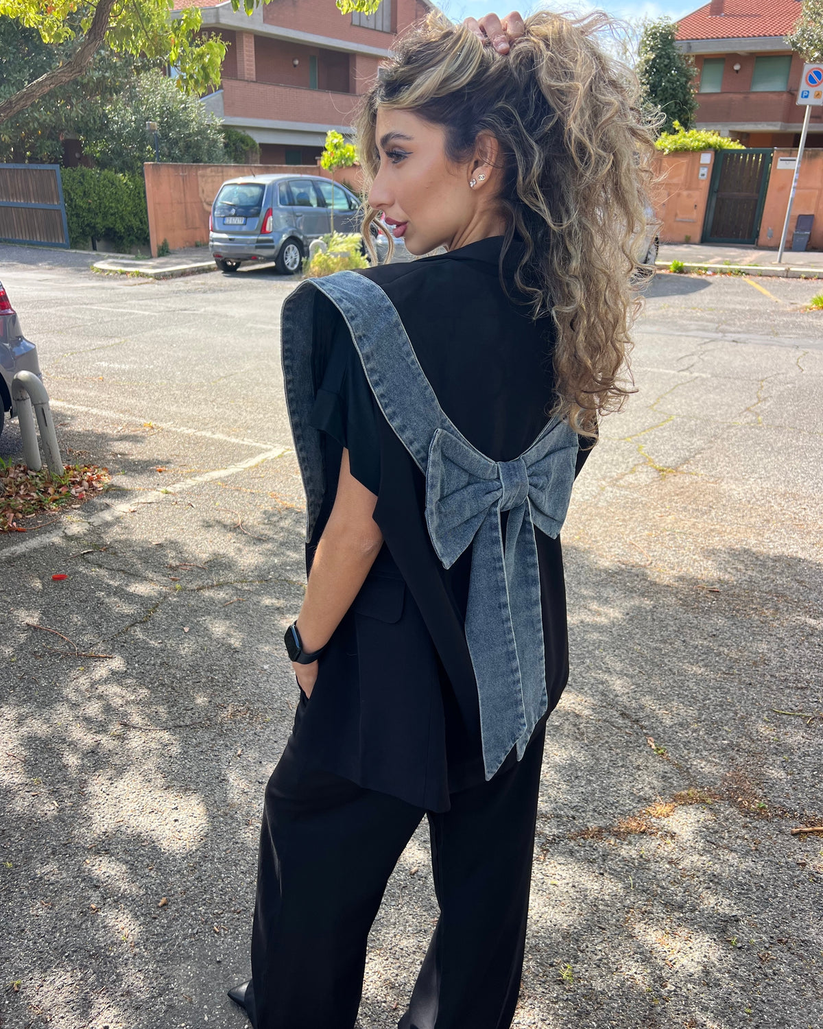Gilet over con dettagli in jeans